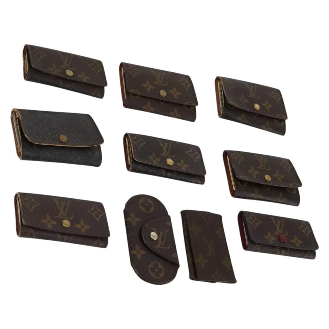 Louis Vuitton Monogram Canvas Key Case 10 Piece Set: Louis Vuitton Monogram Canvas Key Case 10 Piece Set This Louis Vuitton Monogram Key Case is crafted from signature monogram canvas and is designed for women. The item is heavily used, with notable sig