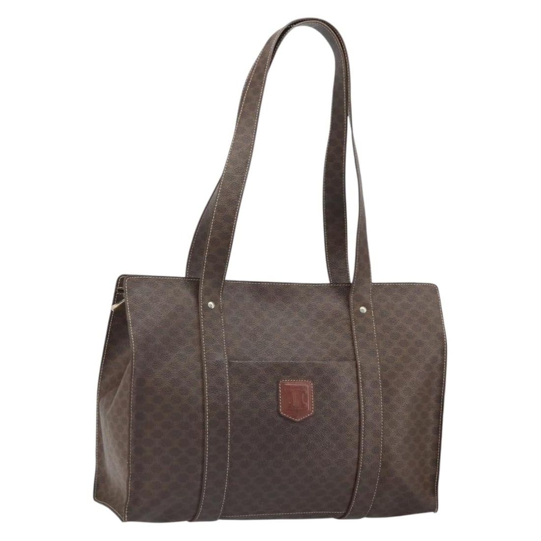Celine Macadam Brown PVC Canvas Tote with Gold Tone Accents: Celine Macadam Brown PVC Canvas Tote with Gold Tone Accents This CELINE Macadam Canvas tote bag features a brown and gold color scheme with PVC leather and the classic Macadam canvas design. Designed 