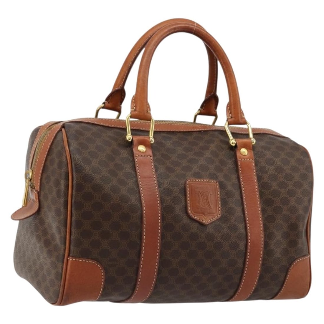 Celine Macadam Boston Bag Brown PVC Leather Canvas Gold Tone: Celine Macadam Boston Bag Brown PVC Leather Canvas Gold Tone A CELINE Boston bag in brown and gold, made from PVC leather and Macadam canvas. It measures approximately W30 x H18 x D6 cm, with a handle