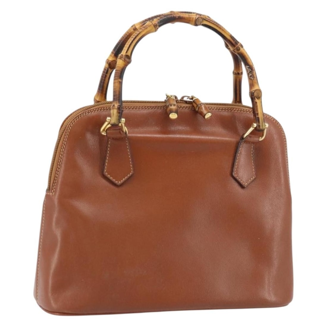 Gucci Bamboo leather brown gold handbag 000 2058 0290: Gucci Bamboo leather brown gold handbag 000 2058 0290 This GUCCI Bamboo Hand Bag features brown and gold leather with bamboo-style handles, offering a classic and sophisticated look. The bag is design