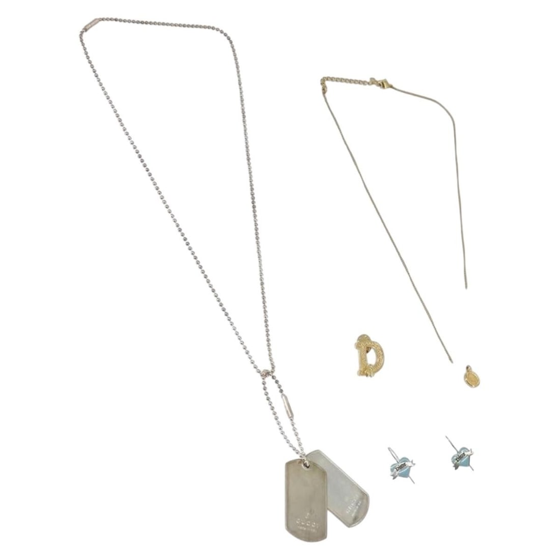 Set of 4 Christian Dior Gold and Silver Metal Charms: Set of 4 Christian Dior Gold and Silver Metal Charms This is a set of four Christian Dior metal charms in both gold and silver tones. The set originates from France and includes only the items shown i