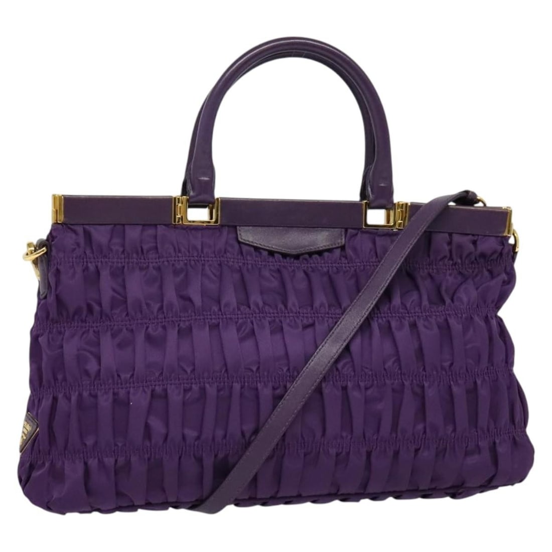 Prada Purple Gold Nylon 2way Handbag Italy: Prada Purple Gold Nylon 2way Handbag Italy This PRADA 2-way handbag is crafted from durable nylon in a striking purple and gold color combination. Designed for versatility, it can be carried by hand o