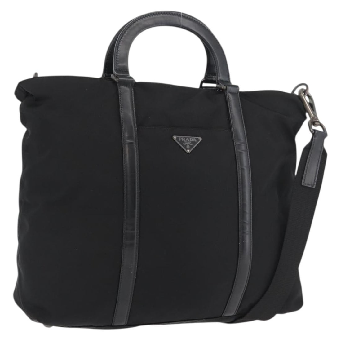 Prada 2way Black Nylon Handbag with Leather Trim and Shoulder Strap: Prada 2way Black Nylon Handbag with Leather Trim and Shoulder Strap A Prada 2-way hand bag in black and silver, made from nylon with leather details. It comes with a shoulder strap and was made in Ita
