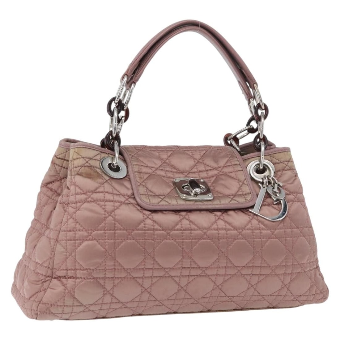Christian Dior pink silver nylon handbag with charm: Christian Dior pink silver nylon handbag with charm This Christian Dior Canage hand bag is crafted from pink and silver nylon and features silver-tone hardware. Designed for women, it offers a spaciou