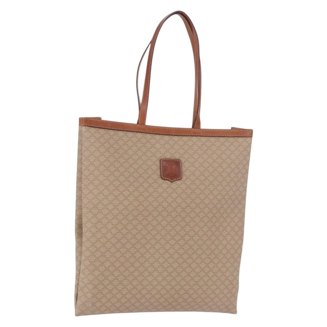 CELINE Macadam Canvas Tote in Beige PVC and Leather: CELINE Macadam Canvas Tote in Beige PVC and Leather Beige CELINE tote bag made from PVC leather and Macadam canvas. Made in Italy, it measures approximately 35 cm wide x 39 cm high x 1.5 cm deep, with