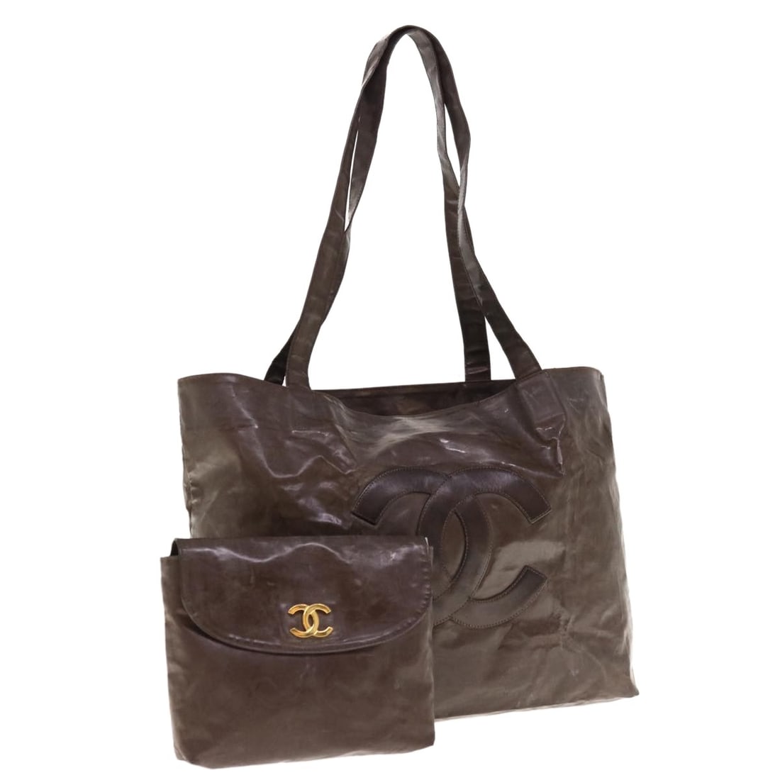 CHANEL Brown Patent Leather Tote Bag with Pouch: CHANEL Brown Patent Leather Tote Bag with Pouch CHANEL tote bag in brown patent leather, made in Italy. It comes with a pouch and features a spacious tote silhouette with approximate dimensions of 15.