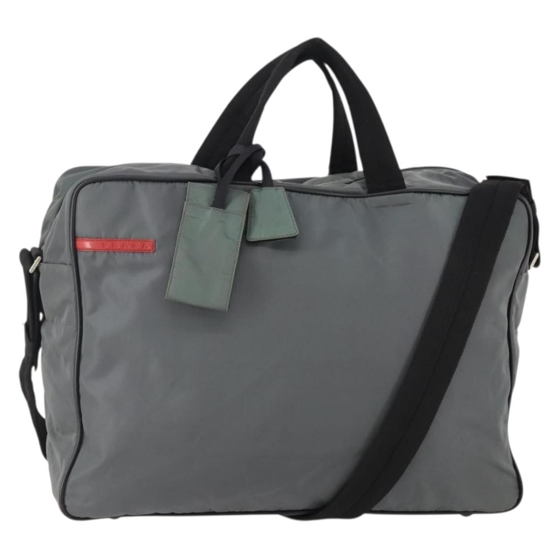 Prada gray nylon handbag with strap and padlock Italy: Prada gray nylon handbag with strap and padlock Italy This women's hand bag is crafted from gray nylon and features both top handles and a detachable shoulder strap for versatile carrying options. The