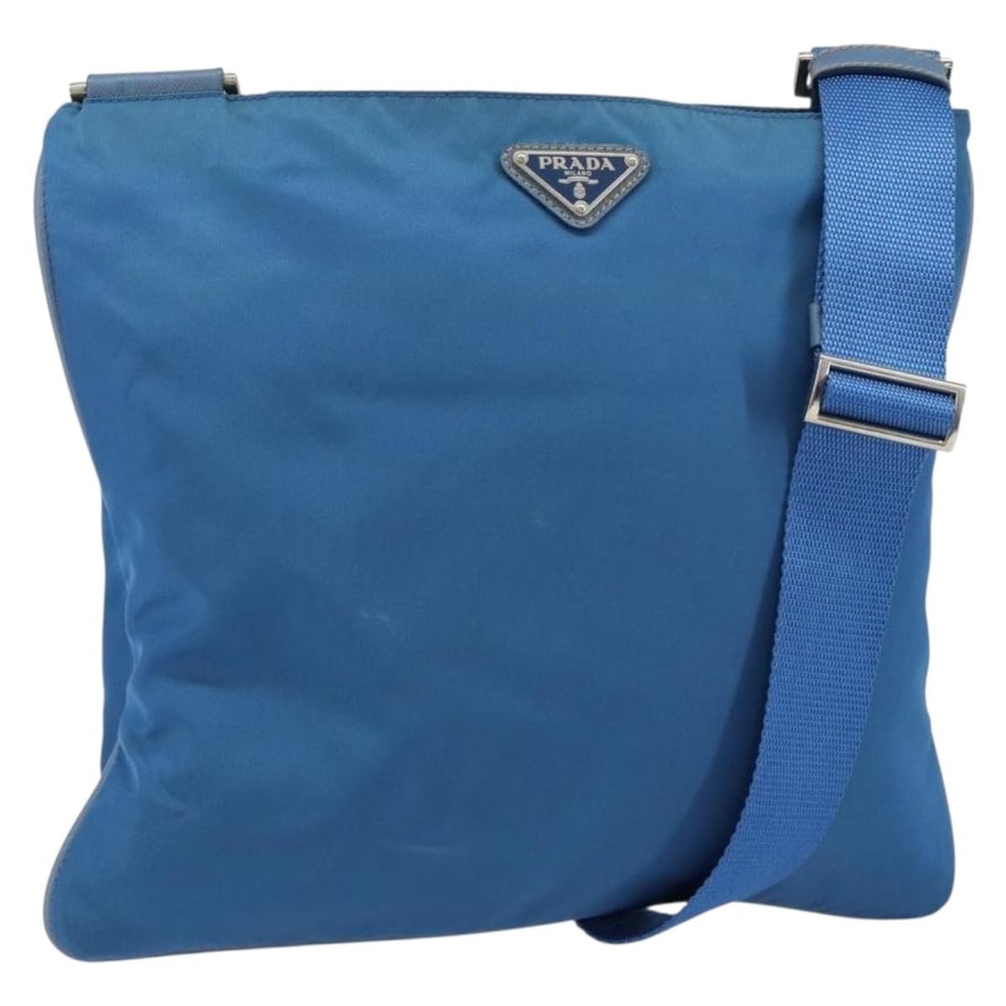 PRADA Blue Nylon Shoulder Bag Silver Tone Hardware Made in Italy: PRADA Blue Nylon Shoulder Bag Silver Tone Hardware Made in Italy A Prada shoulder bag in blue and silver nylon, made in Italy. The bag measures approximately W30 x H27 x D1 cm, with a shoulder drop of