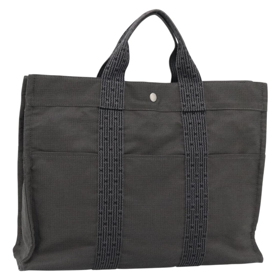 HERMES Her Line MM Canvas Handbag Gray Silver France: HERMES Her Line MM Canvas Handbag Gray Silver France Hermes Her Line MM hand bag in canvas with a gray and silver color scheme. This women's bag was made in France and measures approximately 43 cm W x