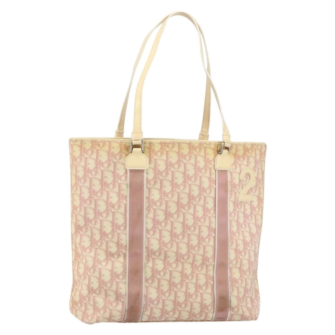 Christian Dior Pink PVC Trotter Canvas Tote Bag Silver Accents Made in Italy: Christian Dior Pink PVC Trotter Canvas Tote Bag Silver Accents Made in Italy This Christian Dior Trotter Canvas tote bag features a pink and silver exterior made from PVC leather and canvas. The tote 