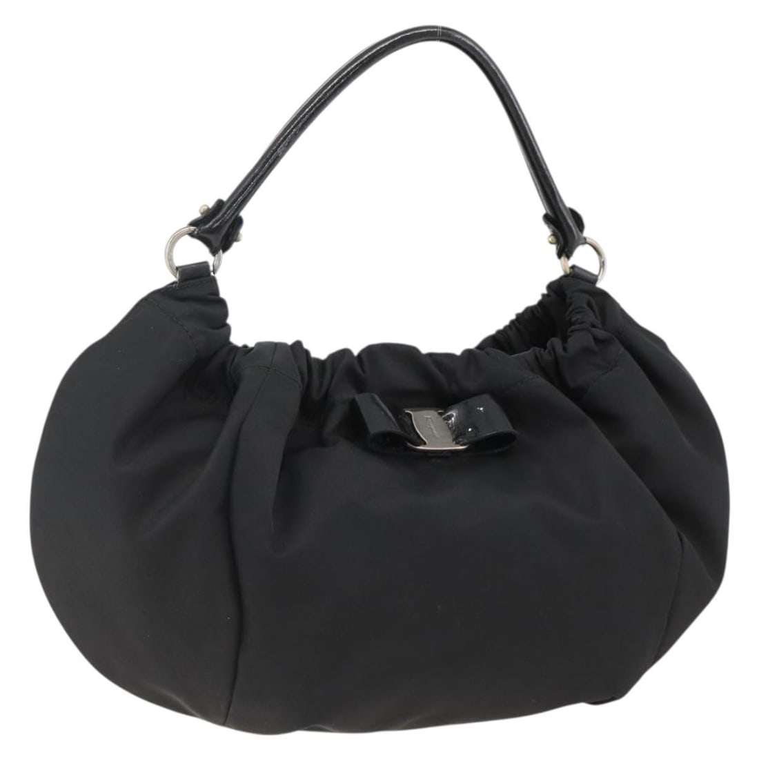 Black Nylon Vala Handbag by Salvatore Ferragamo with Silver Accents: Black Nylon Vala Handbag by Salvatore Ferragamo with Silver Accents This Salvatore Ferragamo Vala handbag is crafted from black nylon with silver-tone accents. Designed for women, it features a spacio