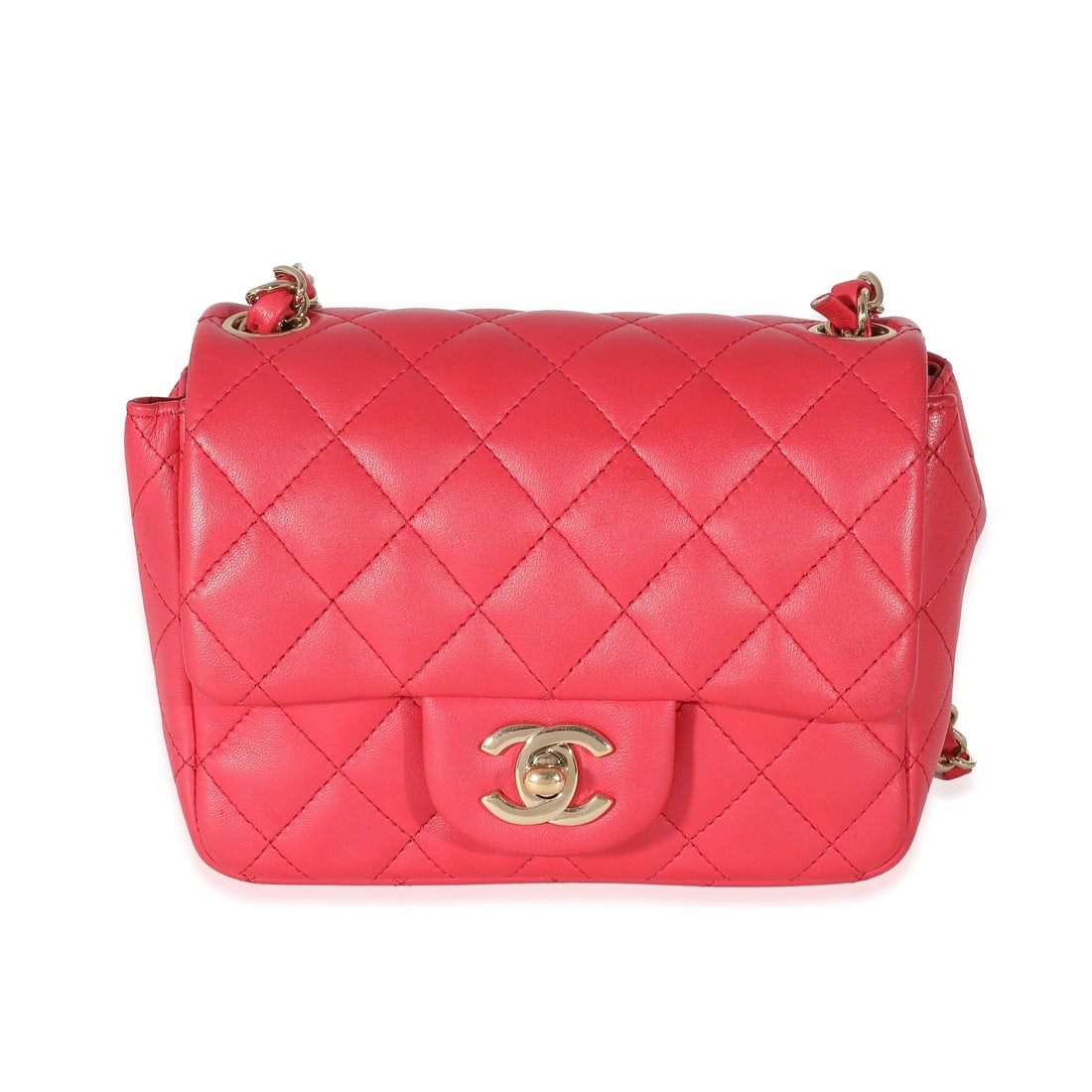 Chanel Mini Square Flap Bag Pink Lambskin Quilted Crossbody: Chanel Mini Square Flap Bag Pink Lambskin Quilted Crossbody Dark pink quilted mini square flap bag with a turnlock closure and gold-tone hardware. It is made of leather with a lambskin finish, and fea
