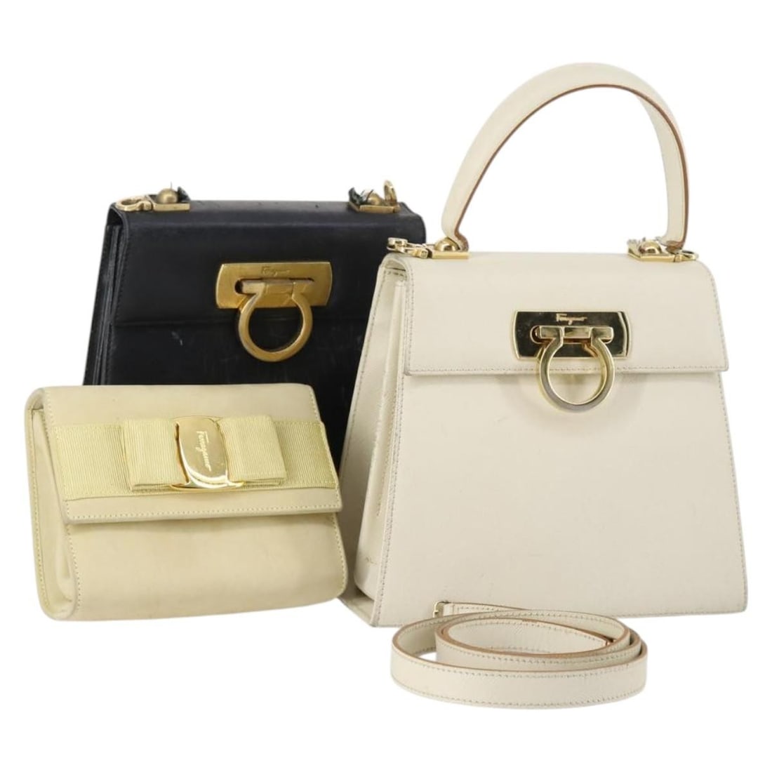 Salvatore Ferragamo Vala Leather Shoulder Bag 3 Piece Set: Salvatore Ferragamo Vala Leather Shoulder Bag 3 Piece Set This Salvatore Ferragamo Gancini Vala bag set includes three leather shoulder bags in beige, black, and white. Made in Italy, these bags are d