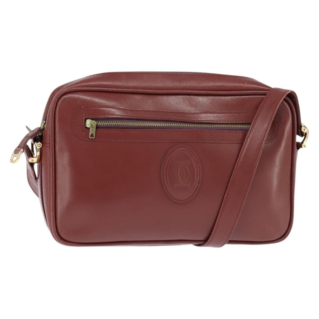 CARTIER Must Line Bordeaux Leather Shoulder Bag Gold Accents: CARTIER Must Line Bordeaux Leather Shoulder Bag Gold Accents Elevate your style with this authentic CARTIER Must Line Shoulder Bag, crafted from luxurious leather in a striking bordeaux and gold color