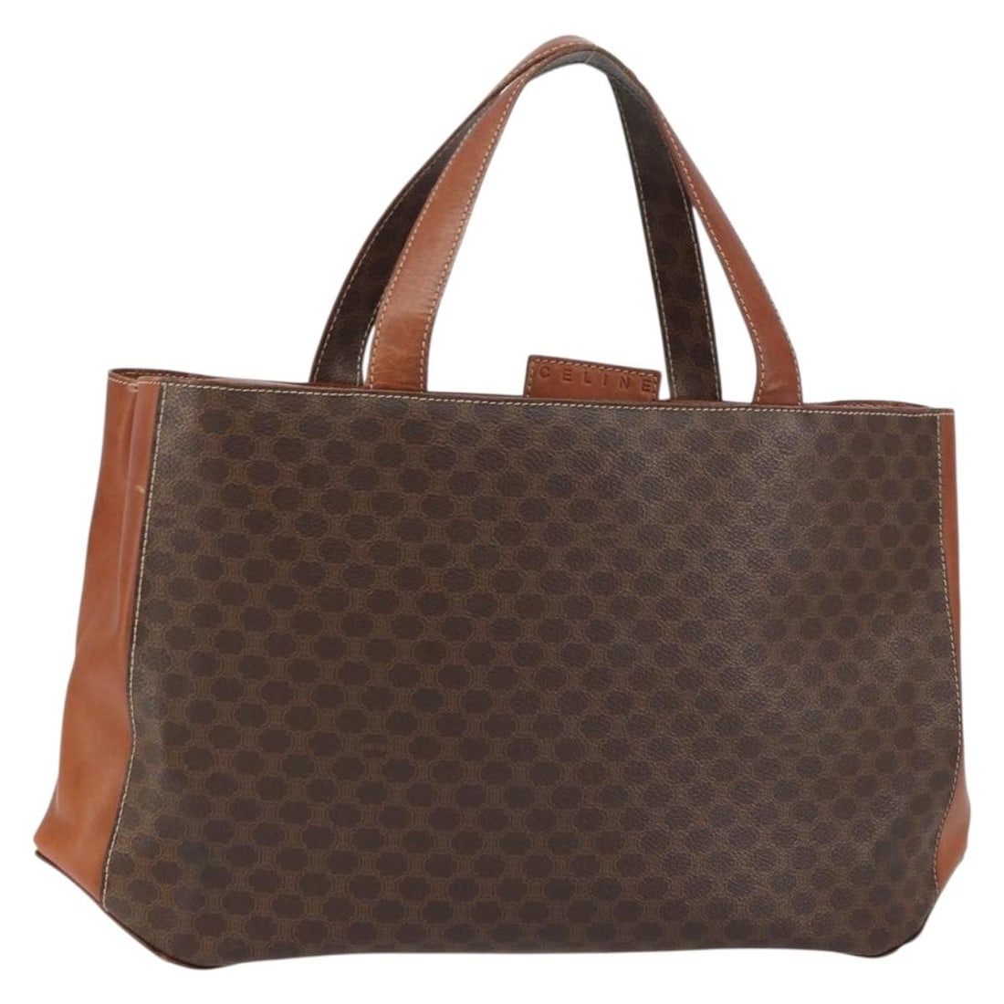Celine Macadam Brown PVC Leather Handbag with Gold Accents: Celine Macadam Brown PVC Leather Handbag with Gold Accents This CELINE Macadam handbag is crafted in brown and gold PVC leather with Macadam canvas accents. Made in Italy, it features a structured sil