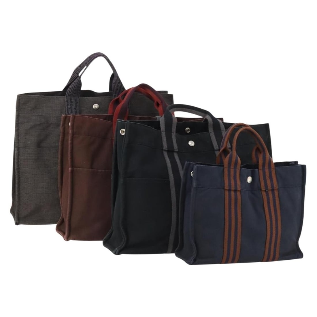 4 Hermes Cotton Tote Bags Black Gray Bordeaux France: 4 Hermes Cotton Tote Bags Black Gray Bordeaux France Hermes tote bag set in black, gray, and bordeaux, made of cotton and made in France. The item is in heavily used condition with visible wear, inclu