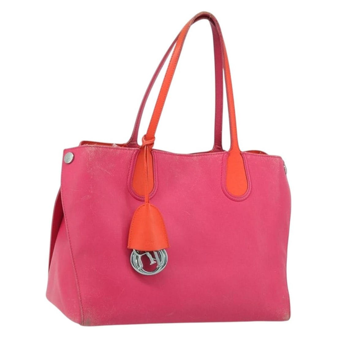 Christian Dior Pink Leather Tote with Charm: Christian Dior Pink Leather Tote with Charm This Christian Dior tote bag features pink and silver leather with a matching charm accessory. Designed for women, it offers a spacious interior and practic