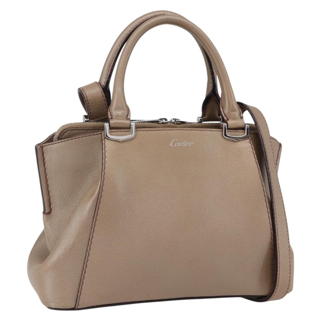 Cartier Mini C De Beige Silver Leather 2way Handbag: Cartier Mini C De Beige Silver Leather 2way Handbag This CARTIER Mini C De Cartier handbag features a beige and silver leather exterior with both handle and adjustable shoulder strap options, allowing
