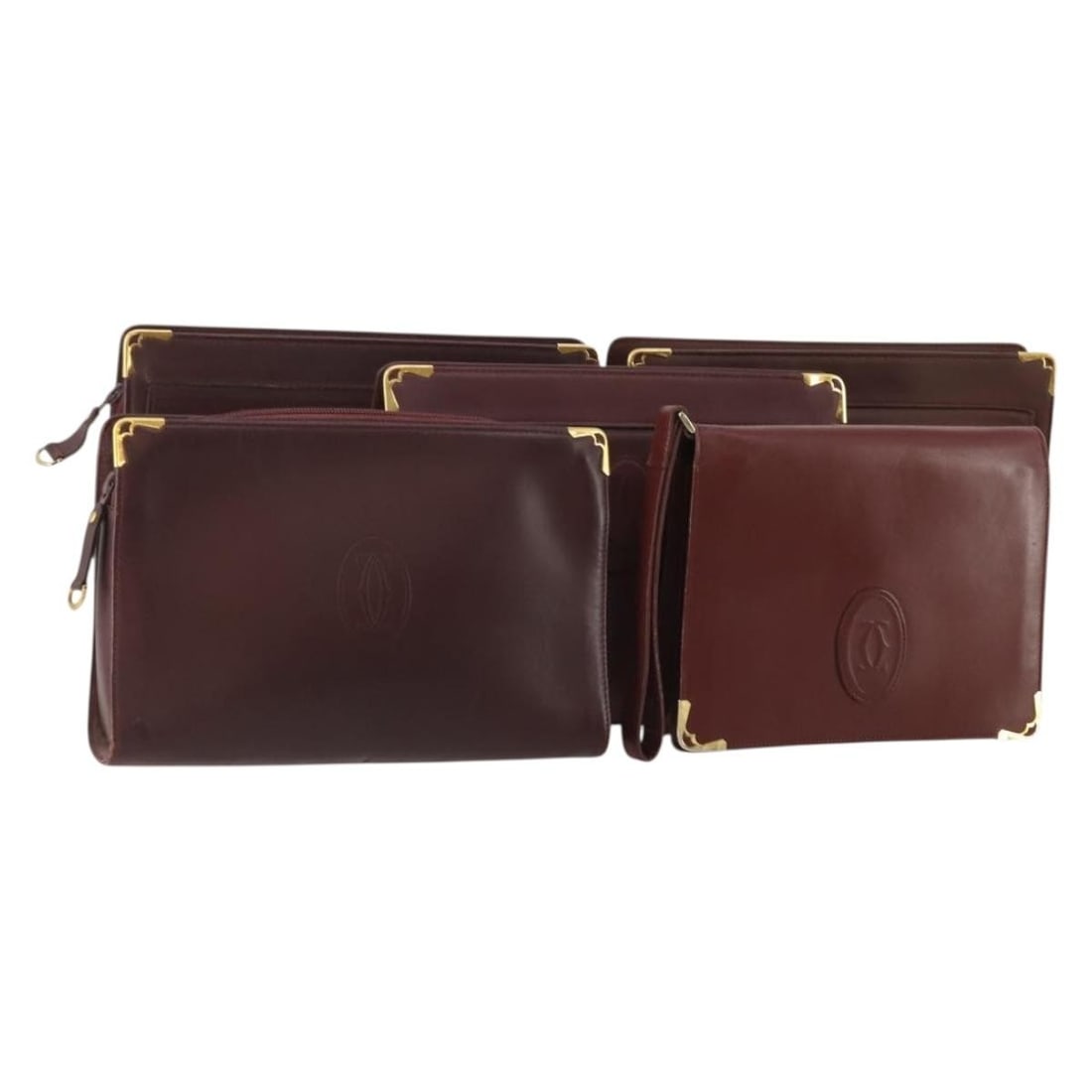 Cartier leather clutch bag set of 5 Bordeaux gold tone: Cartier leather clutch bag set of 5 Bordeaux gold tone Bordeaux and gold Cartier clutch bag in leather, offered as a special set sale. The item is heavily used and shows visible wear including out-of-