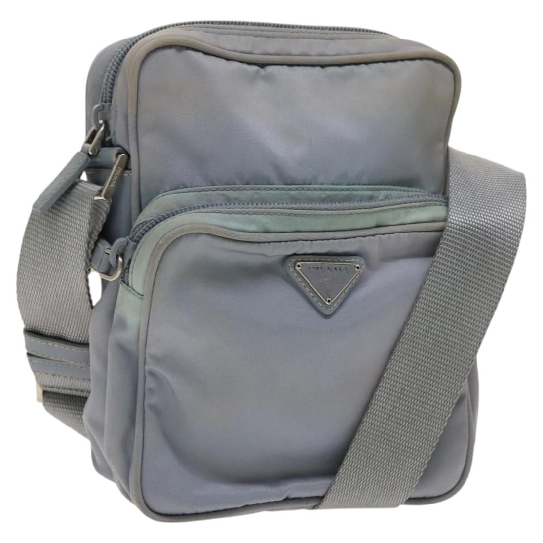 Prada Nylon Light Blue Silver Shoulder Bag Italy: Prada Nylon Light Blue Silver Shoulder Bag Italy This PRADA shoulder bag is crafted from light blue nylon with silver-tone accents. Designed for women, it features an adjustable shoulder strap for ver