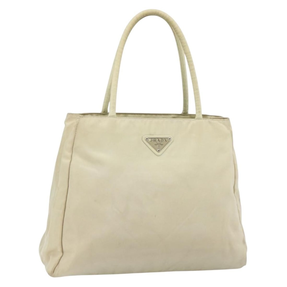 Prada ivory silver nylon handbag Italy 12.6 x 10.2 x 4.3in: Prada ivory silver nylon handbag Italy 12.6 x 10.2 x 4.3in This PRADA handbag is crafted from ivory and silver nylon, offering a stylish and practical accessory for everyday use. Made in Italy, this w
