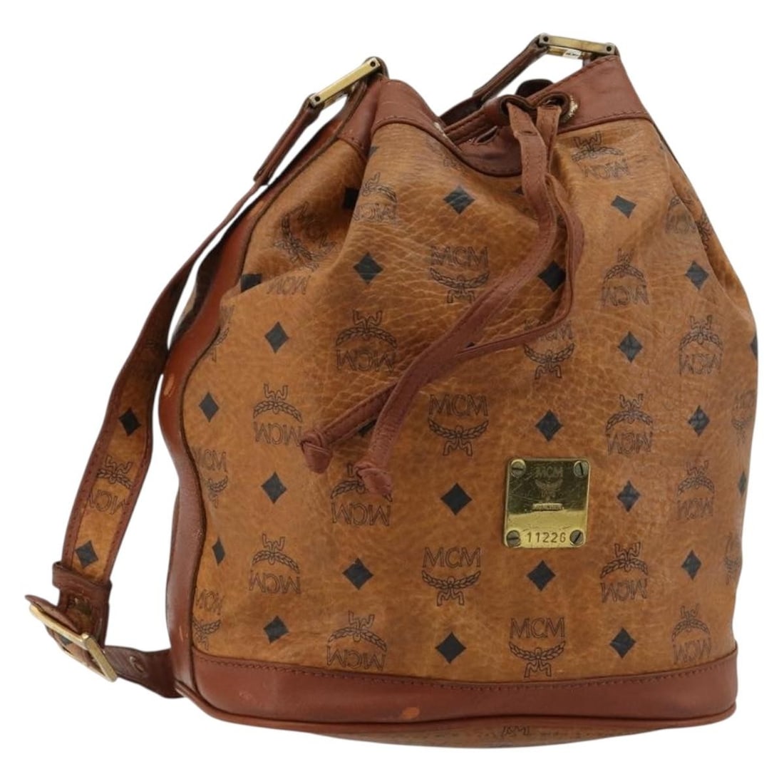 MCM Vicetos Logogram PVC Leather Shoulder Bag Brown Gold: MCM Vicetos Logogram PVC Leather Shoulder Bag Brown Gold MCM Vicetos logogram shoulder bag in brown and gold PVC leather. This women's shoulder bag was made in Germany and features an adjustable shoul