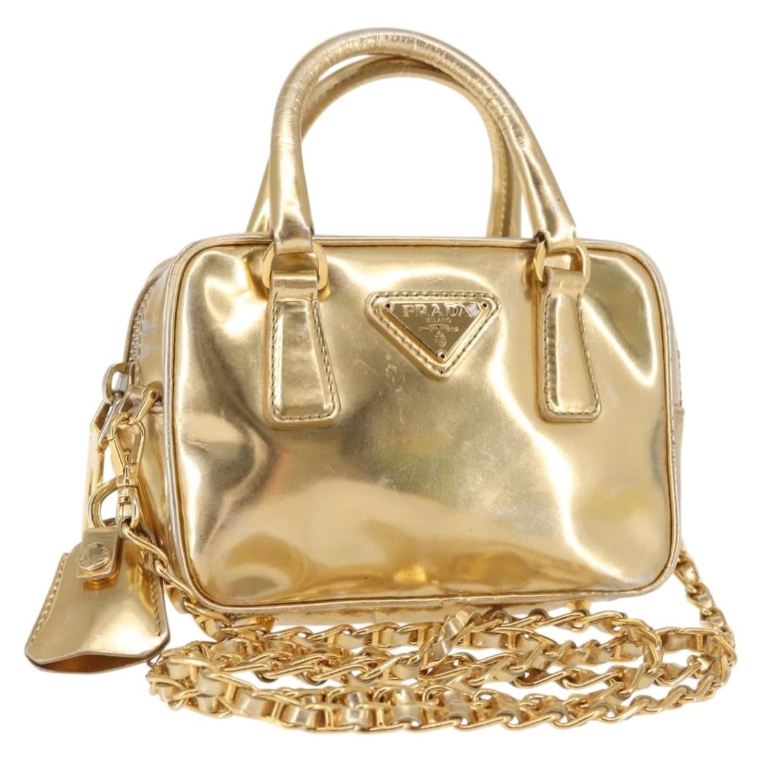 PRADA Gold Leather Hand Bag 2-way Authentic Made in Italy: PRADA Gold Leather Hand Bag 2-way Authentic Made in Italy This authentic PRADA Hand Bag is a luxurious accessory crafted in Italy from high-quality leather. The bag showcases a stunning gold exterior 