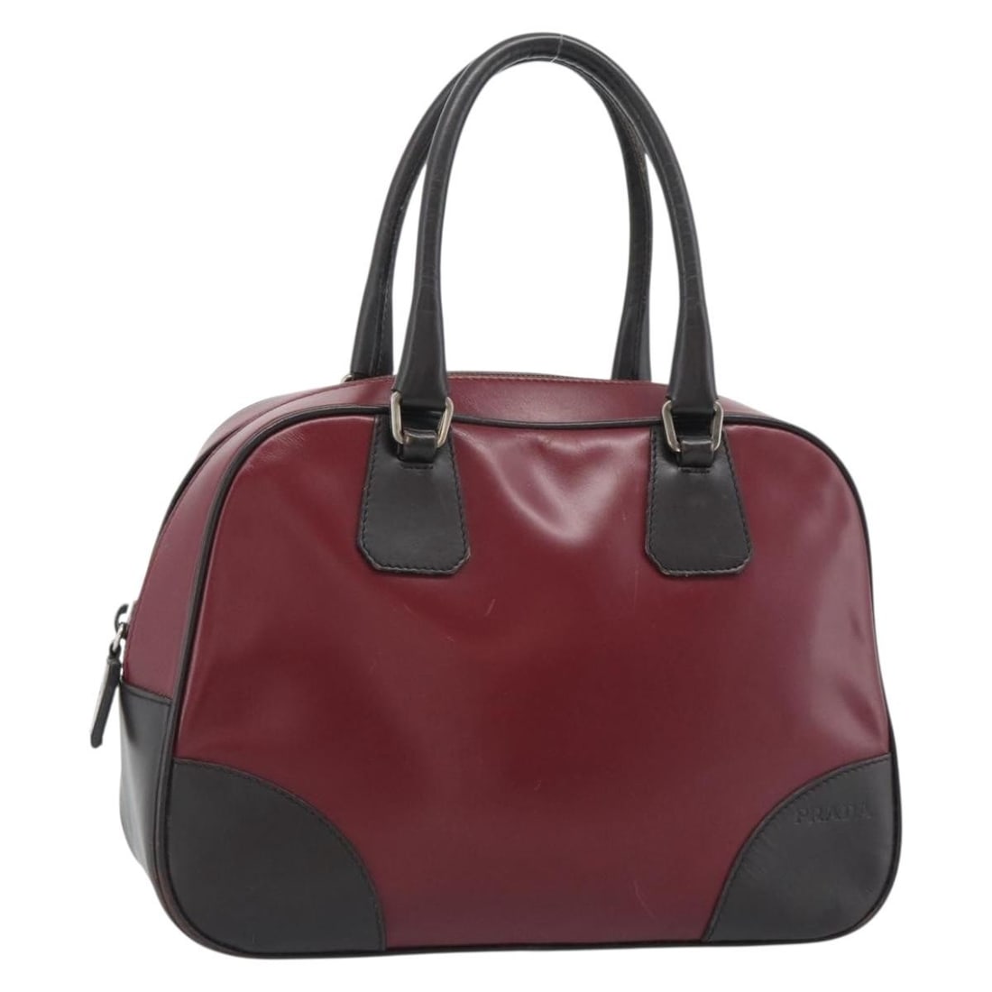 Prada Leather Handbag Red and Black Made in Italy: Prada Leather Handbag Red and Black Made in Italy A Prada leather handbag in red and black, made in Italy. The bag measures approximately 26 cm W x 18 cm H x 10 cm D, with a handle drop of approximate