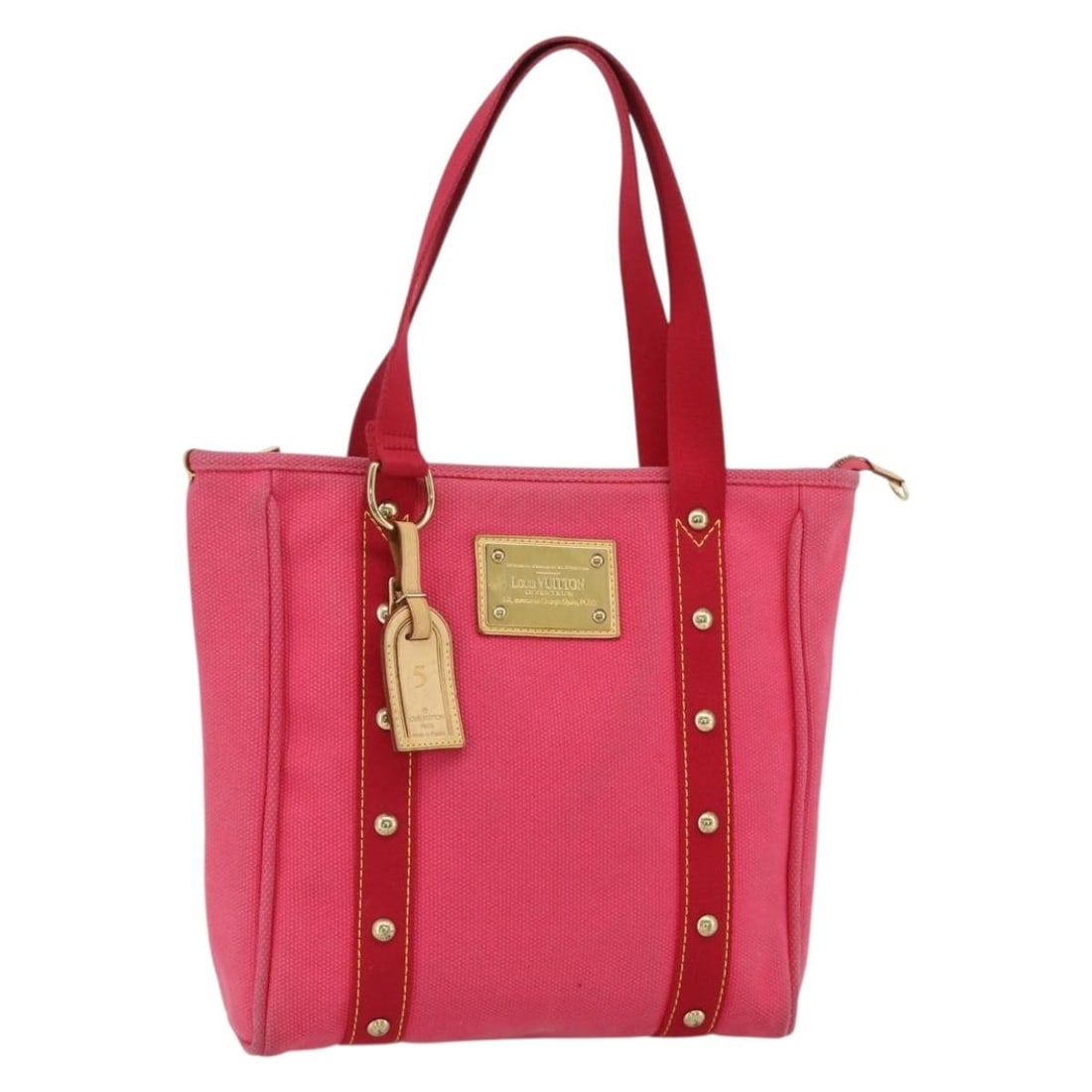 Louis Vuitton Antigua Cabas MM Pink Canvas Tote M40085 Name Tag: Louis Vuitton Antigua Cabas MM Pink Canvas Tote M40085 Name Tag This Louis Vuitton Antigua Cabas MM tote bag features a pink canvas exterior and is designed for women. The bag includes a name tag with