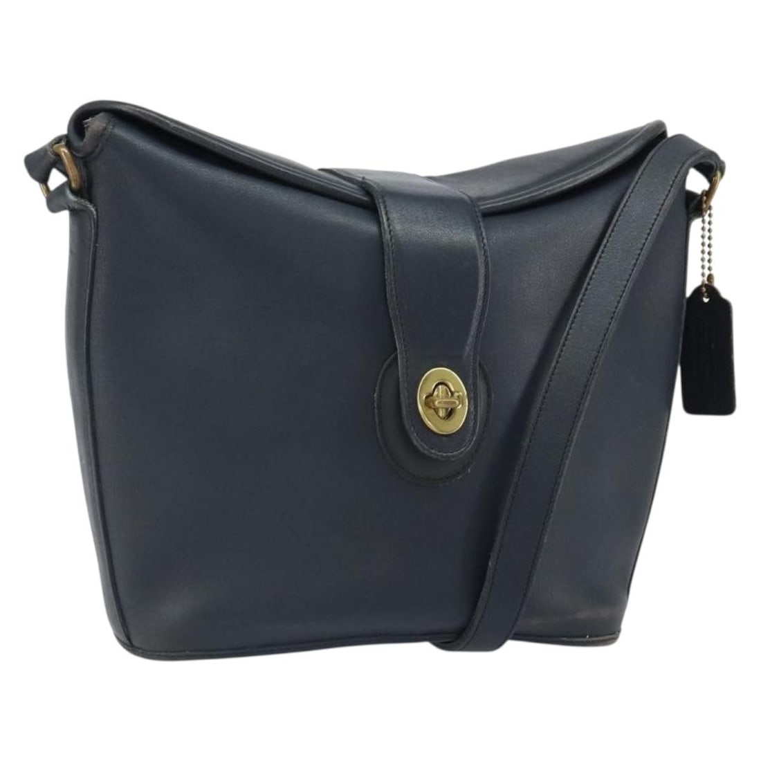 Coach Navy Leather Shoulder Bag With Gold Tone Hardware USA: Coach Navy Leather Shoulder Bag With Gold Tone Hardware USA This Coach shoulder bag for women features a navy leather exterior with gold-tone accents. The bag is made in the USA and is designed with a