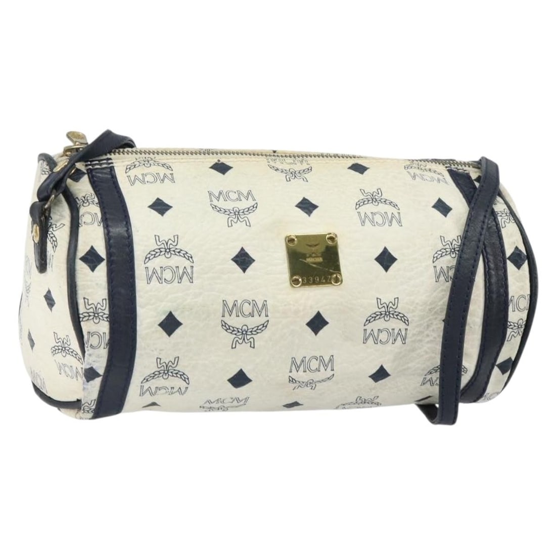 White Gold MCM Vicetos Logogram PVC Leather Shoulder Bag from Germany: White Gold MCM Vicetos Logogram PVC Leather Shoulder Bag from Germany This MCM Vicetos Logogram shoulder bag features a white and gold PVC leather exterior with a signature logogram design. The bag in