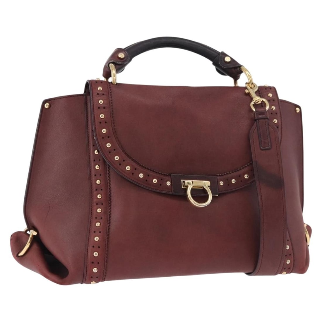 Salvatore Ferragamo Gancini Leather 2way Bordeaux Gold Hand Bag: Salvatore Ferragamo Gancini Leather 2way Bordeaux Gold Hand Bag This Salvatore Ferragamo Gancini handbag is crafted from leather in a Bordeaux and gold color scheme. Designed as a 2-way bag, it featur