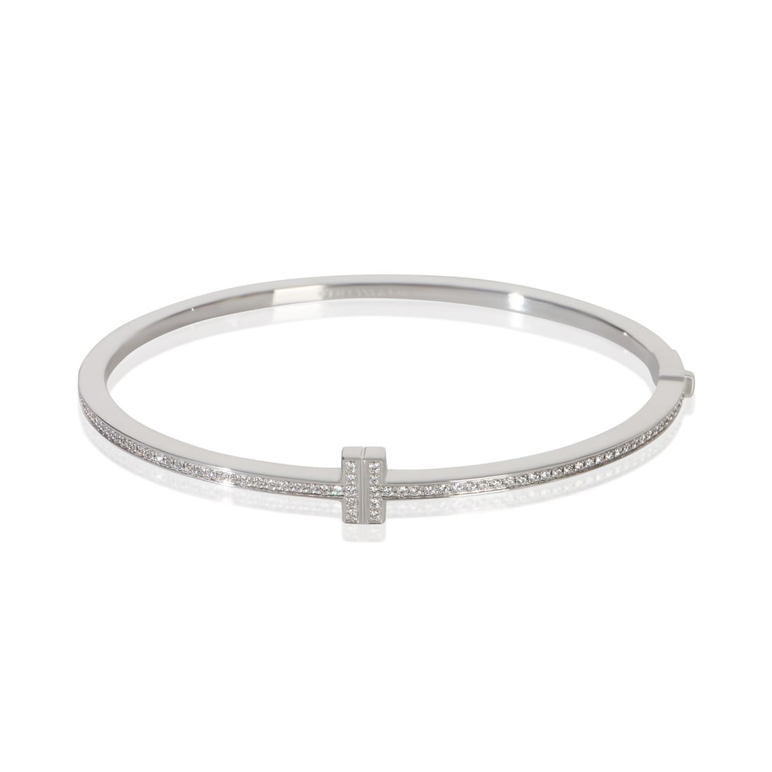 Tiffany T Narrow Hinged Diamond Bracelet 18k White Gold 6.5 in: Tiffany T Narrow Hinged Diamond Bracelet 18k White Gold 6.5 in This Tiffany & Co. T Narrow Hinged Bracelet is crafted from 18k white gold and set with round brilliant diamonds totaling 0.33 carats. It