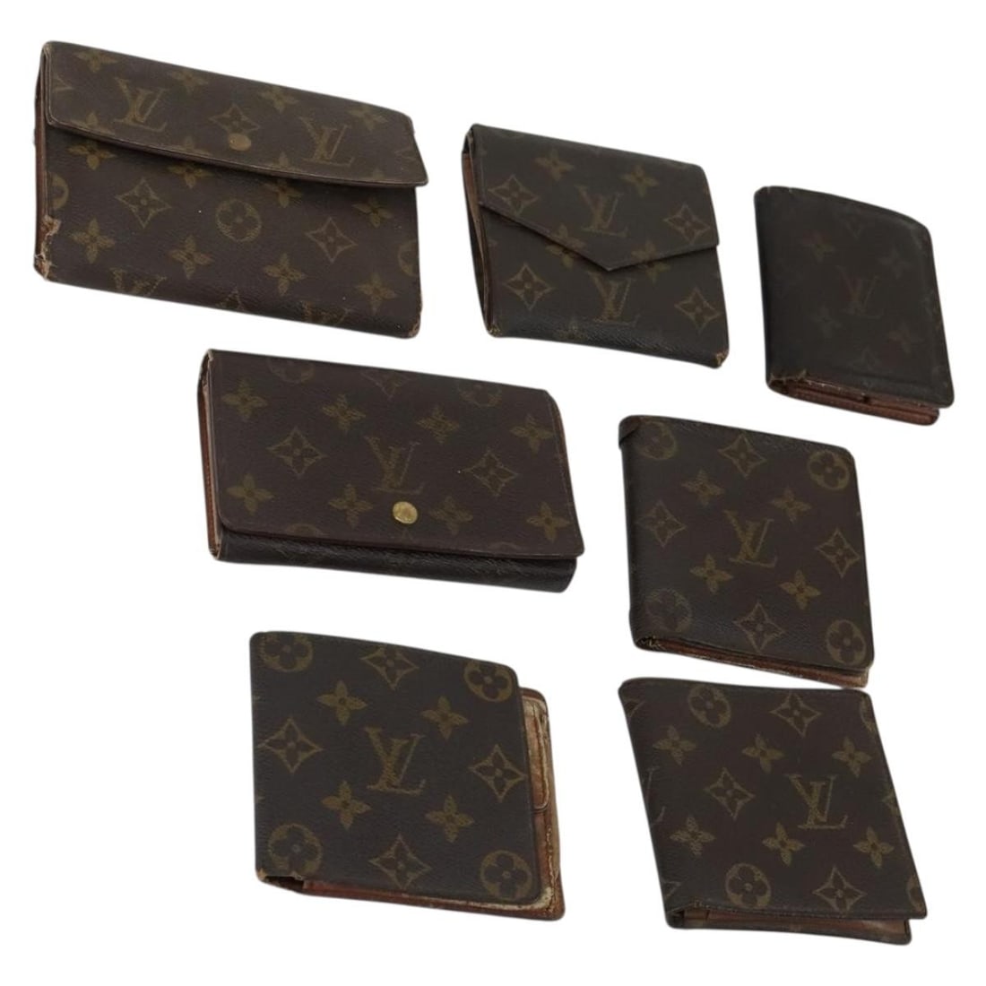 Set of 7 Louis Vuitton Monogram Canvas Women's Wallets: Set of 7 Louis Vuitton Monogram Canvas Women's Wallets This is a heavily used Louis Vuitton Monogram Canvas wallet set for women. The set includes seven wallets, each featuring the signature Monogram 