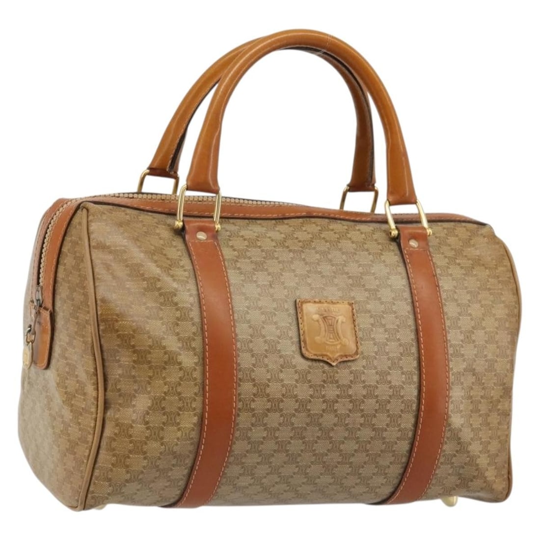 CELINE Macadam Canvas Beige Gold Boston Bag Italy: CELINE Macadam Canvas Beige Gold Boston Bag Italy This CELINE Boston Bag features the iconic Macadam canvas in beige and gold tones, crafted from PVC leather. Designed for women, the bag offers a spac