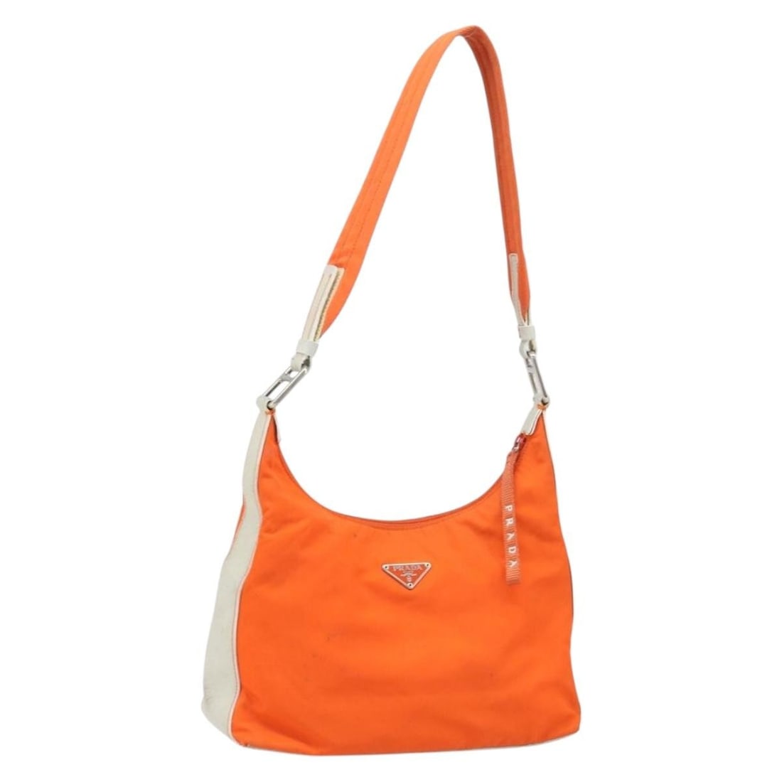 Prada Orange Silver Nylon Shoulder Bag Italy: Prada Orange Silver Nylon Shoulder Bag Italy This PRADA shoulder bag features a vibrant orange and silver color scheme and is crafted from durable nylon. Designed for women, the bag offers a spacious 