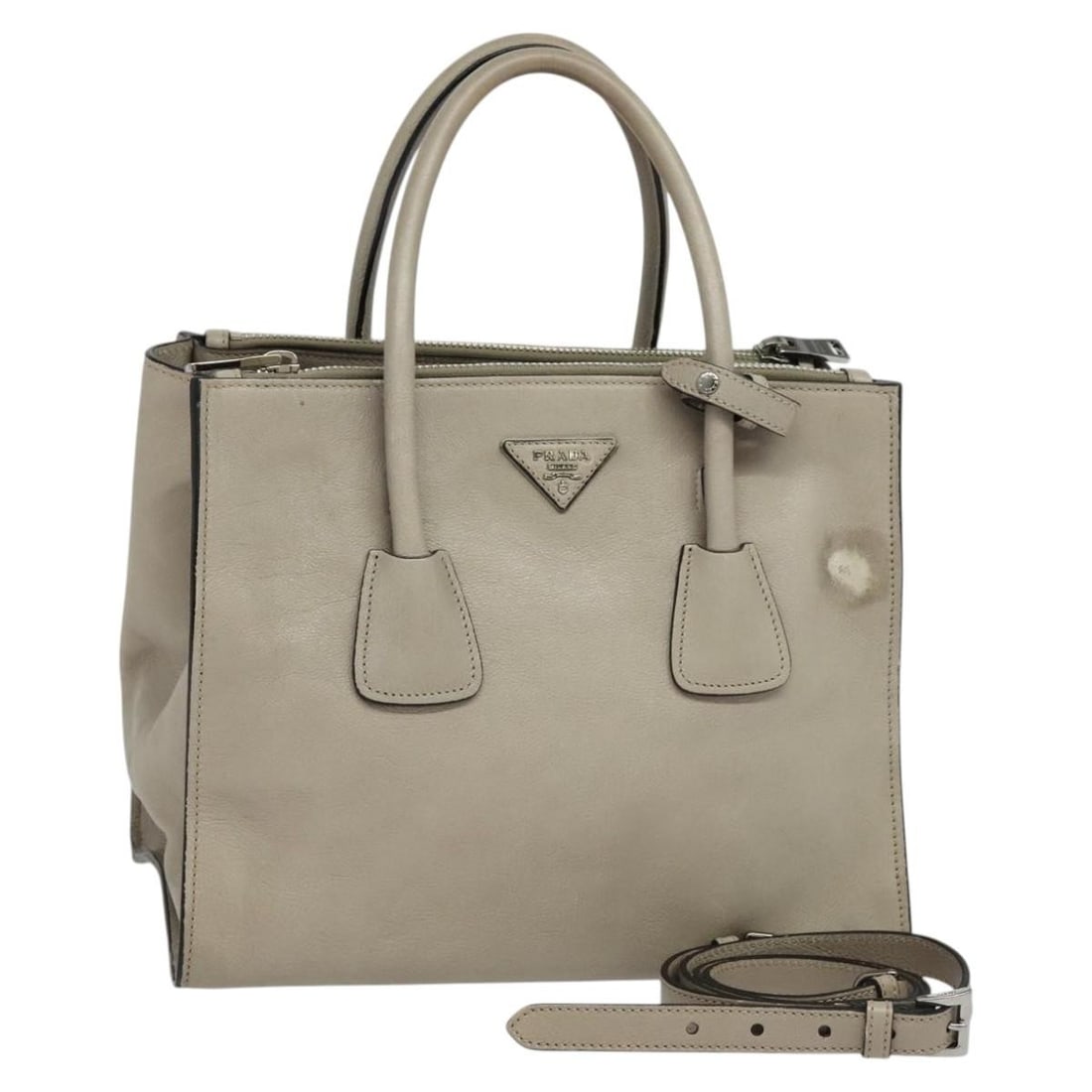 Prada Beige Silver Leather 2way Handbag With Strap Dust Bag: Prada Beige Silver Leather 2way Handbag With Strap Dust Bag This PRADA 2-way handbag is crafted from beige and silver leather, offering versatile carry options with both handles and a detachable shoul