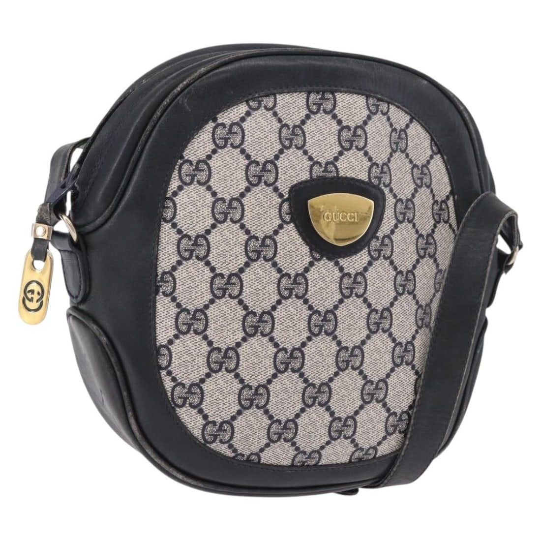 Gucci GG Supreme PVC Leather Shoulder Bag Navy Gold: Gucci GG Supreme PVC Leather Shoulder Bag Navy Gold A Gucci shoulder bag in navy and gold, made from PVC leather and GG canvas. It measures approximately 22 cm wide, 20 cm high, and 6 cm deep, with a 