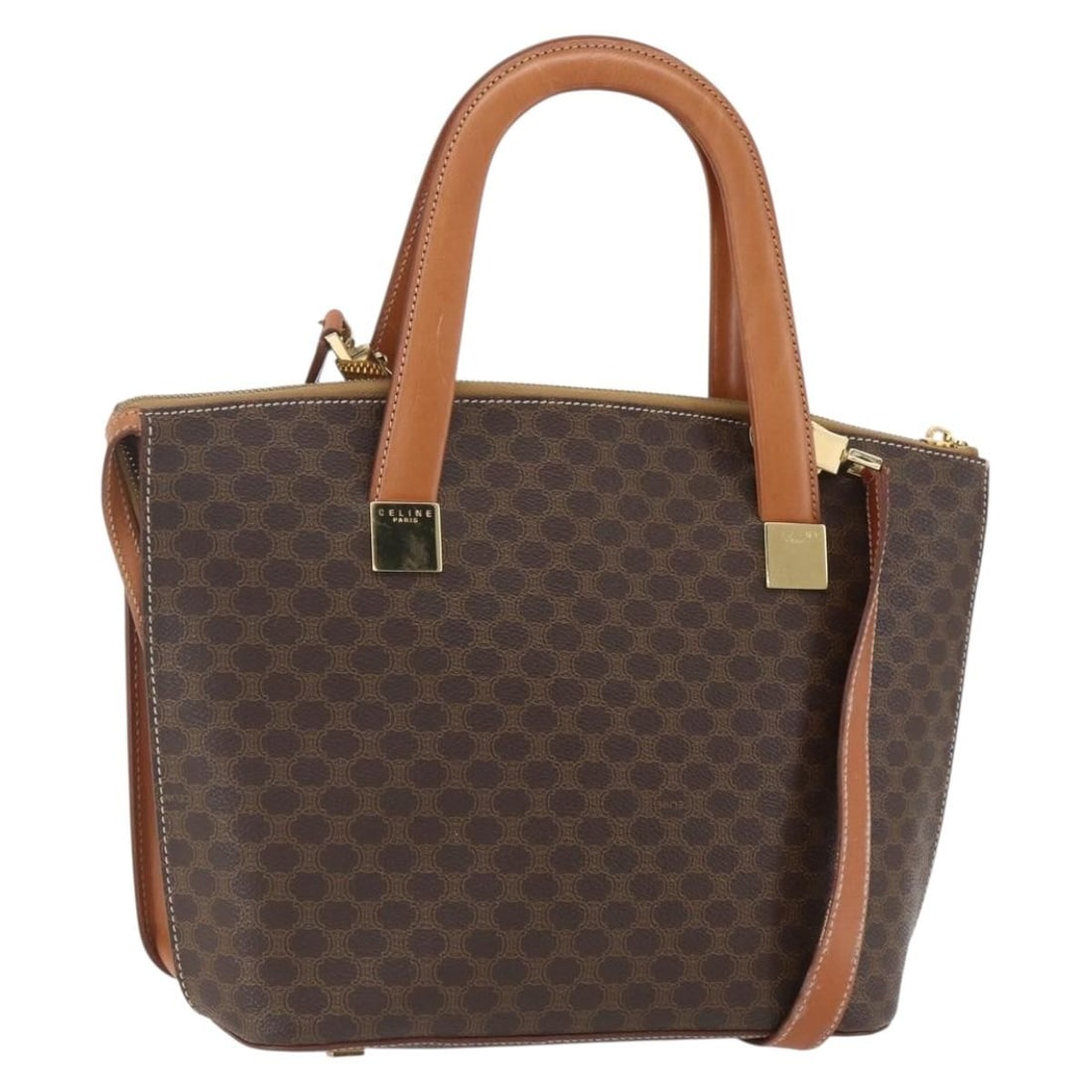 CELINE Macadam 2way Hand Bag Brown PVC Leather with Shoulder Strap: CELINE Macadam 2way Hand Bag Brown PVC Leather with Shoulder Strap A CELINE 2-way hand bag crafted in PVC leather and Macadam canvas, presented in brown and gold. It comes with a shoulder strap and is