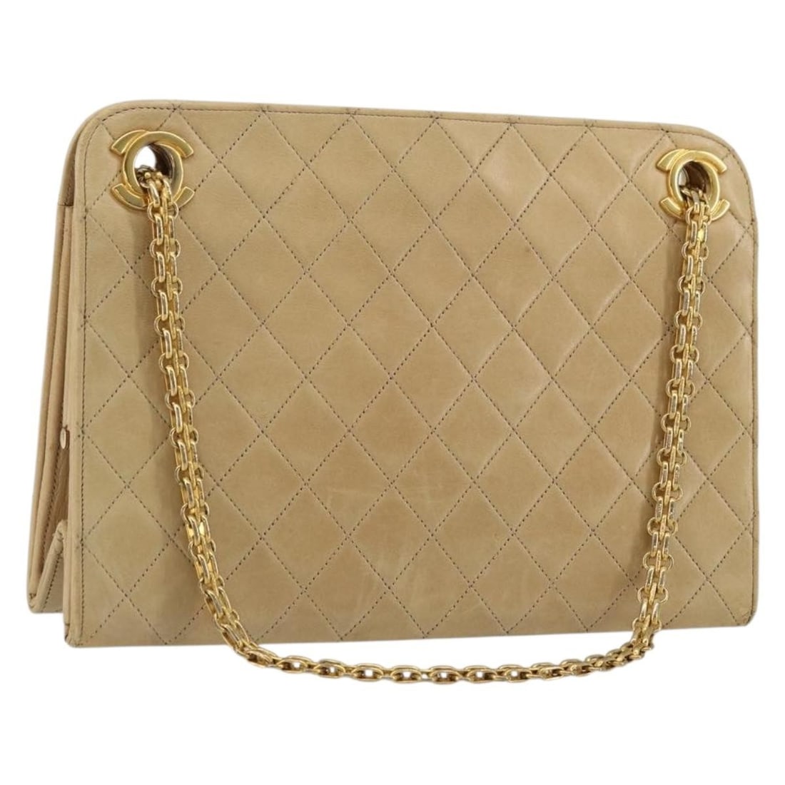 CHANEL Beige Gold Lamb Skin Shoulder Bag Matelasse CC France: CHANEL Beige Gold Lamb Skin Shoulder Bag Matelasse CC France This CHANEL Matelasse chain shoulder bag is crafted from beige lambskin leather with gold-tone accents. Designed for women, the bag feature