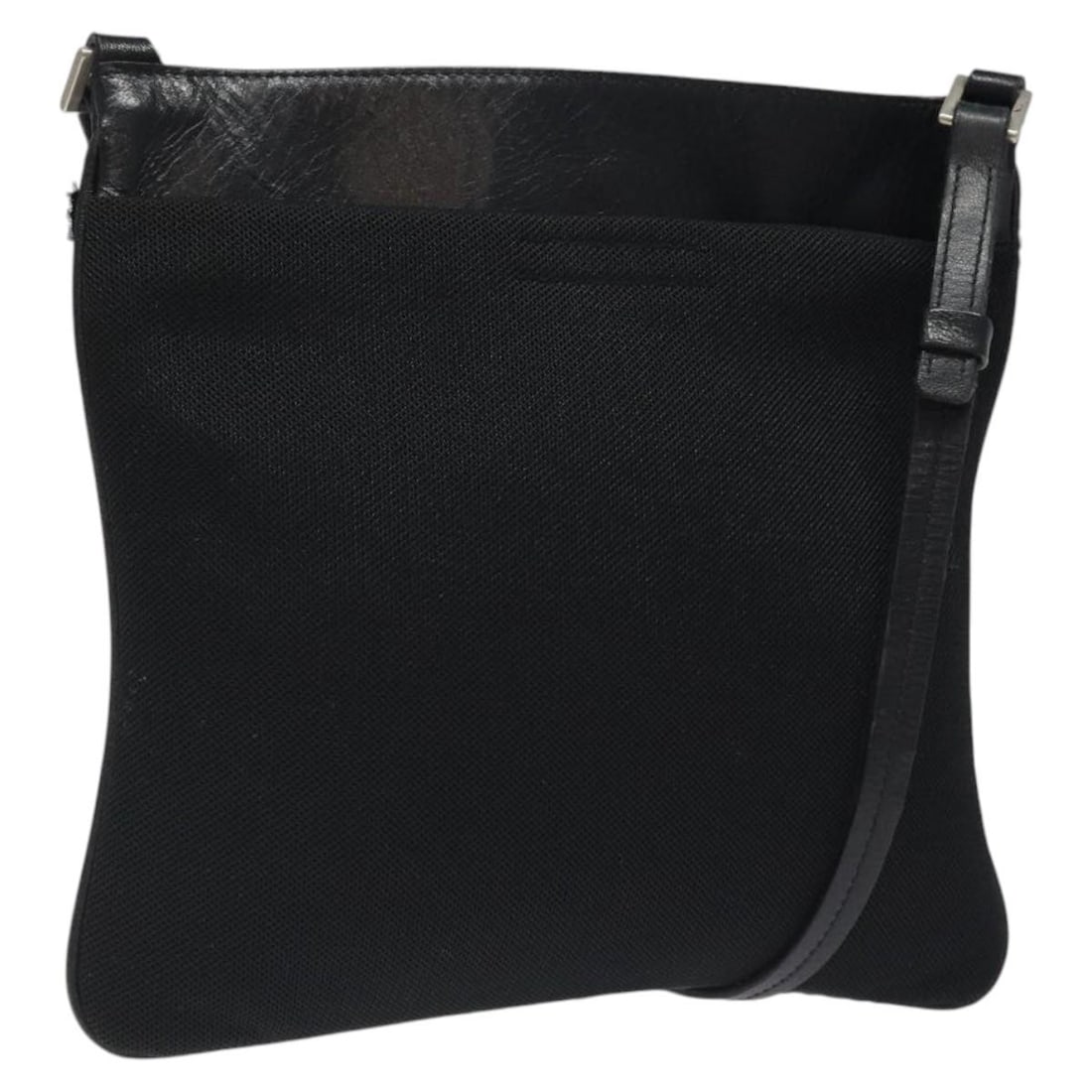 Black Nylon PRADA Shoulder Purse with Silver Accents for Women: Black Nylon PRADA Shoulder Purse with Silver Accents for Women This PRADA shoulder bag is crafted from black nylon with silver-tone accents. Designed for women, it features a practical shoulder strap 