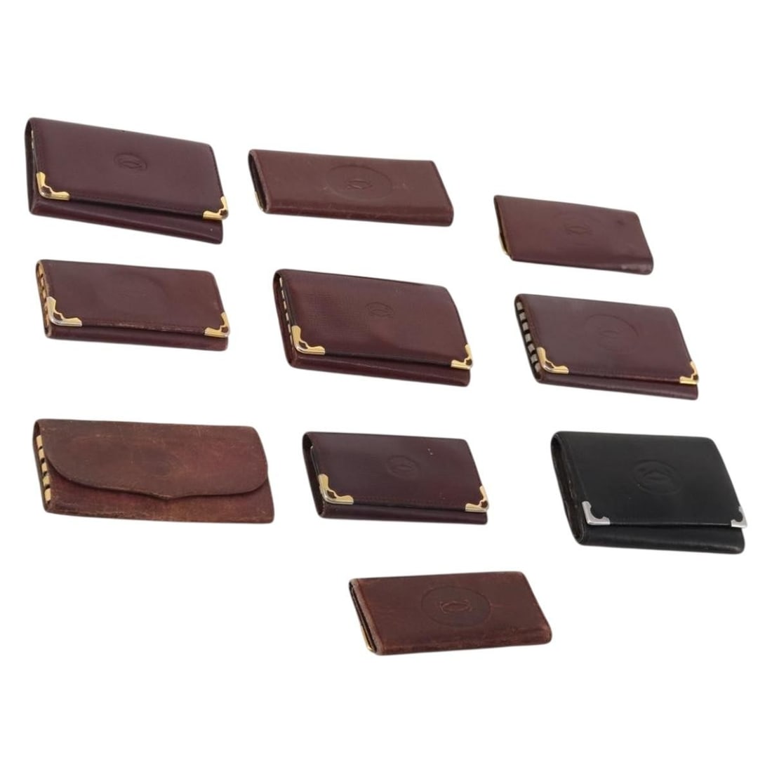 Cartier Bordeaux Leather Key Case 10 Piece Bundle: Cartier Bordeaux Leather Key Case 10 Piece Bundle Cartier leather key case in bordeaux. This women's key case is made in France and shows heavy overall wear, including shape loss, rubbing, stains, cra