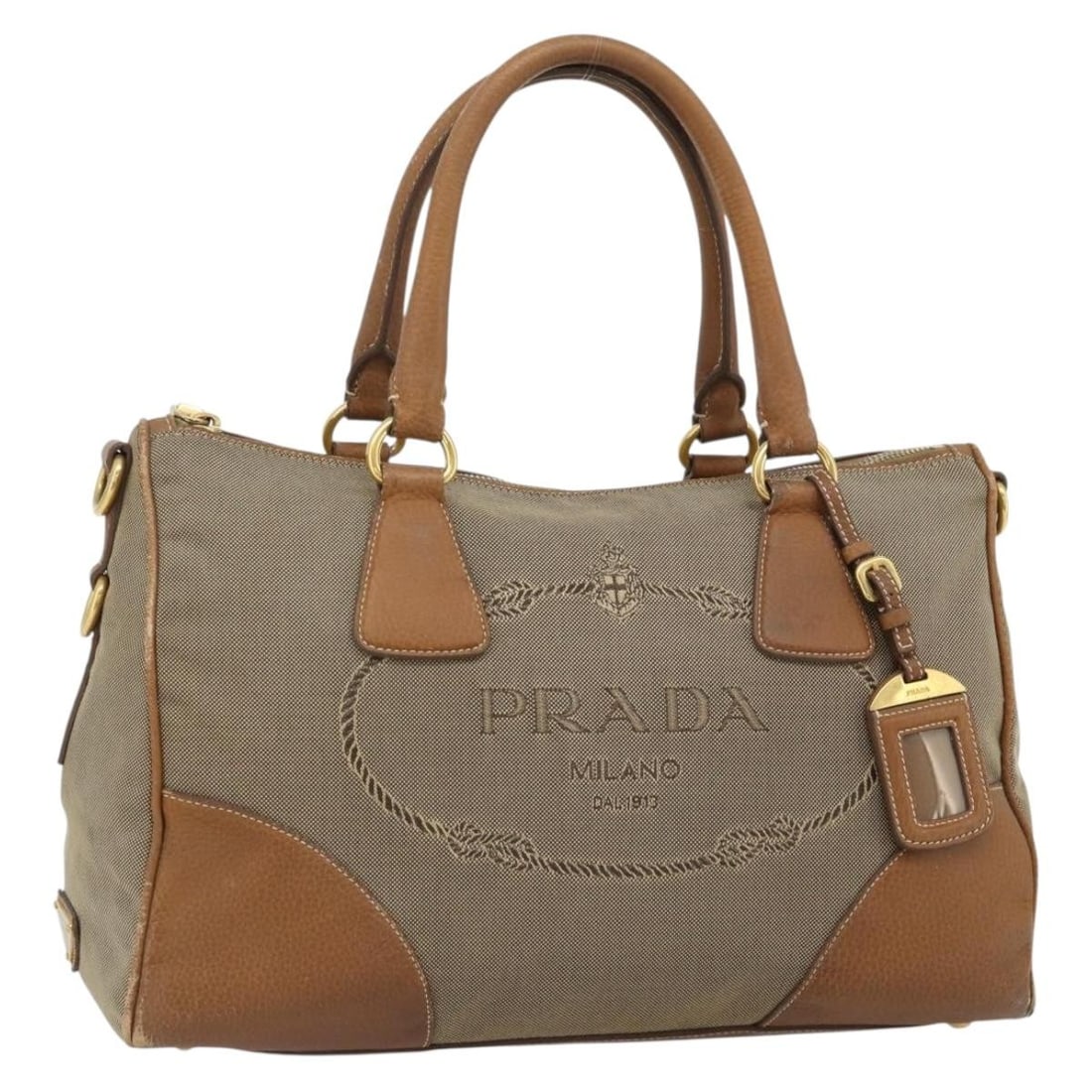 PRADA Brown Canvas Leather Handbag Gold Tone Made in Turkey: PRADA Brown Canvas Leather Handbag Gold Tone Made in Turkey Prada women's handbag in brown and gold canvas with leather trim, made in Turkey. This heavily used bag includes only the item shown; the or