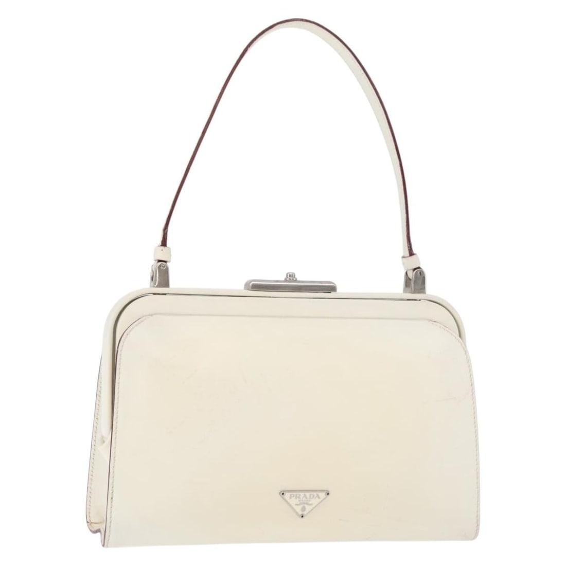 PRADA White Silver Leather Hand Bag with Keys and Clochette: PRADA White Silver Leather Hand Bag with Keys and Clochette Prada leather hand bag in white and silver, made in Italy. It comes with two keys and a clochette. The bag is a women's hand bag with a hand