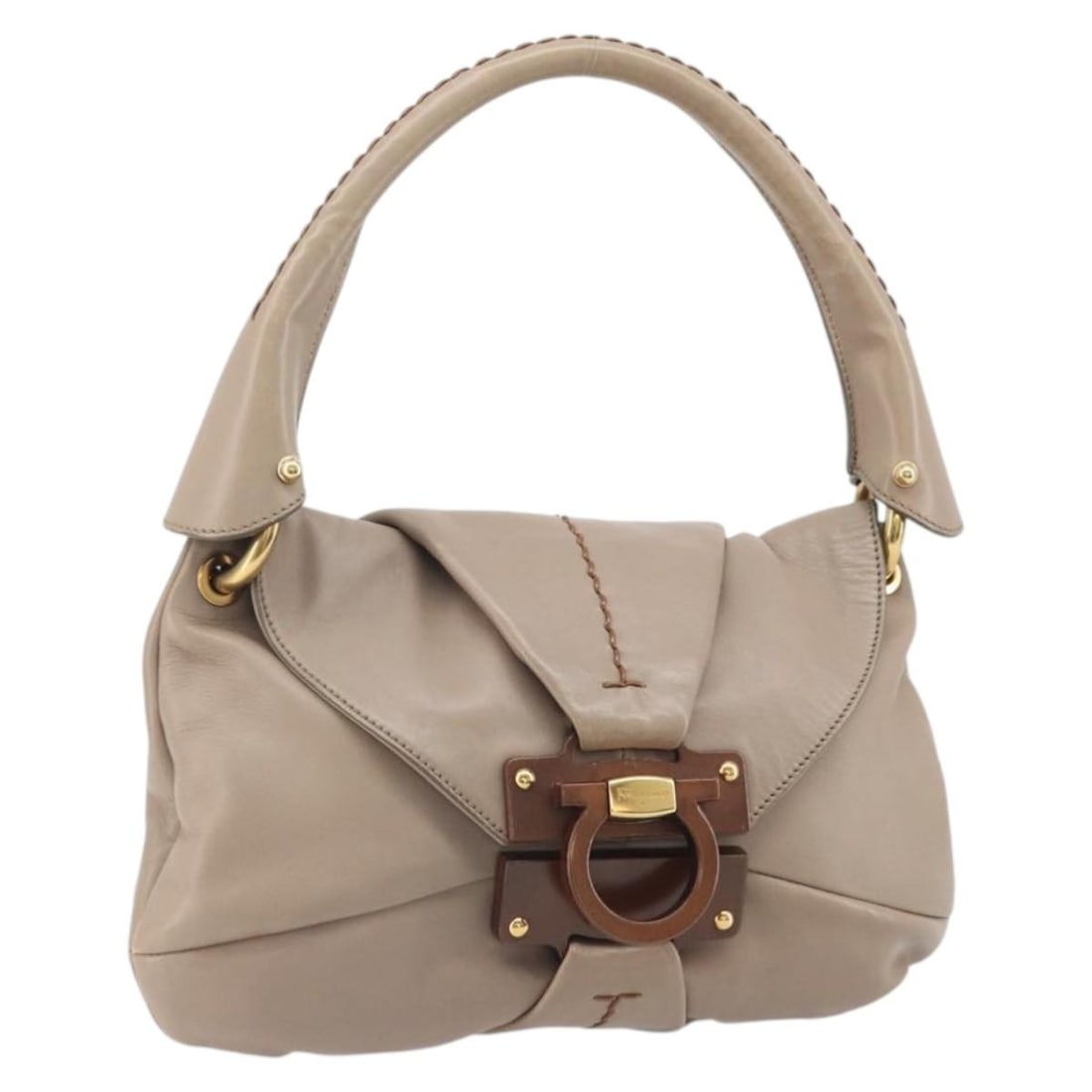 Beige Leather Gancini Handbag by Salvatore Ferragamo Gold Tone Hardware: Beige Leather Gancini Handbag by Salvatore Ferragamo Gold Tone Hardware This Salvatore Ferragamo Gancini handbag features a beige leather exterior with gold accents. Designed for women, it is made in 