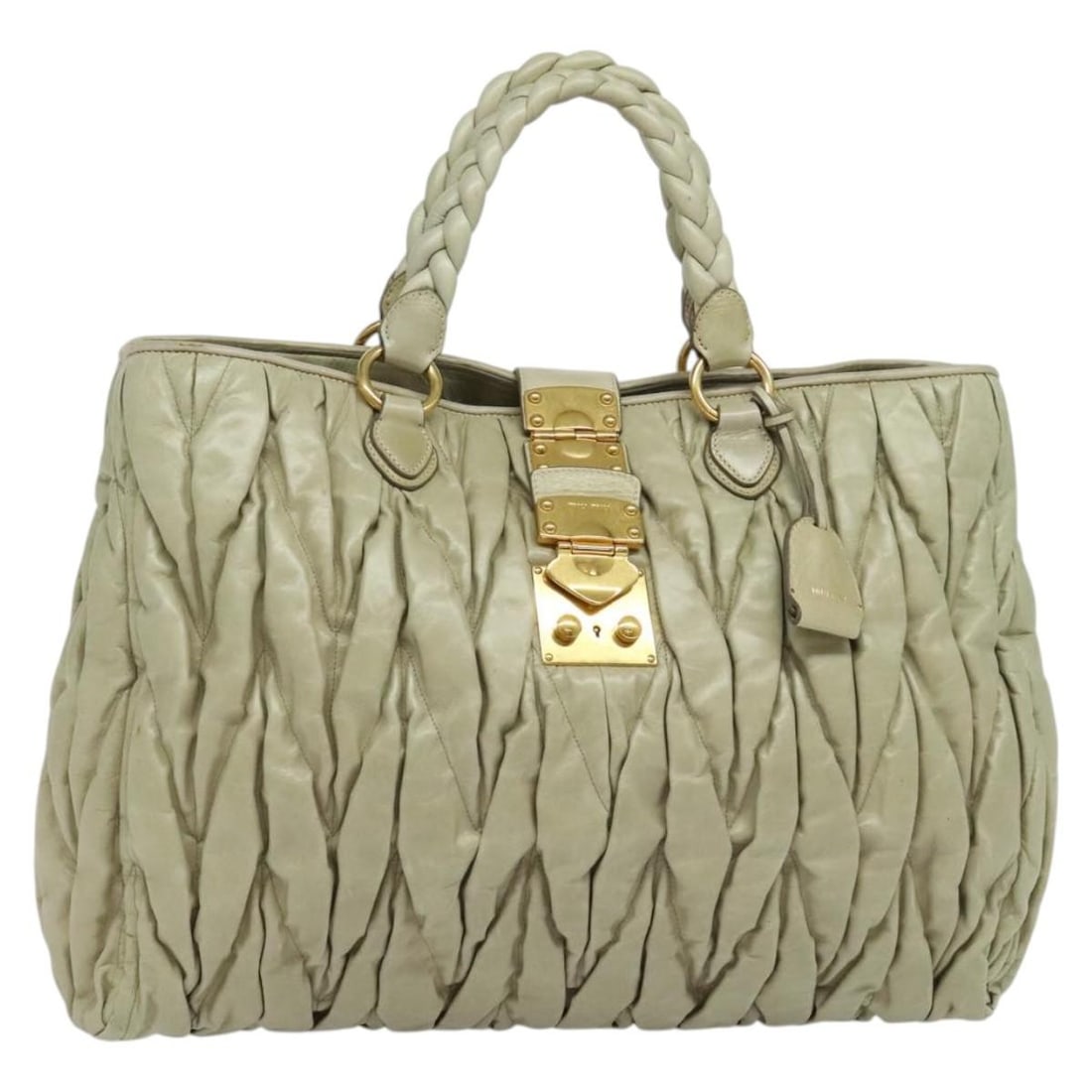 Miu Miu Matelasse Leather Handbag Ivory Gold with Key Clochette: Miu Miu Matelasse Leather Handbag Ivory Gold with Key Clochette Ivory and gold leather hand bag in the Matelasse style, made in Turkey. It comes with one key and a clochette. The item is heavily used,