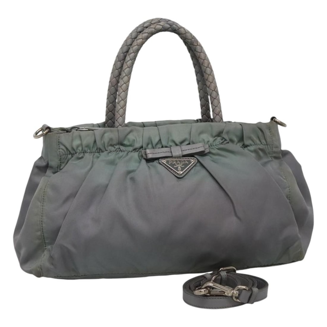 Prada gray nylon handbag with shoulder strap 2way: Prada gray nylon handbag with shoulder strap 2way This PRADA hand bag is crafted from durable nylon in a versatile gray shade. Designed for women, it features a 2-way carrying option with an included 
