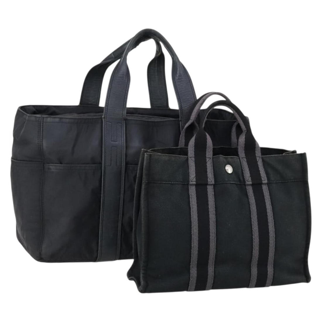 Hermes Black Canvas Tote Bag Set of 2: Hermes Black Canvas Tote Bag Set of 2 This listing features a heavily used HERMES tote bag crafted from black canvas. The bag shows significant signs of wear, including shape loss, rubbing, stains, st