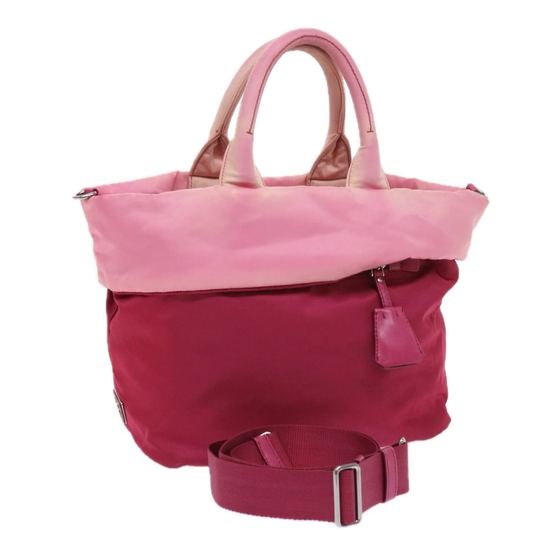 PRADA Pink Nylon 2way Hand Bag with Shoulder Strap: PRADA Pink Nylon 2way Hand Bag with Shoulder Strap Authentic Prada 2-way handbag in pink nylon with a top-handle design and removable shoulder strap. Made in Italy, this women's bag shows heavy use wi
