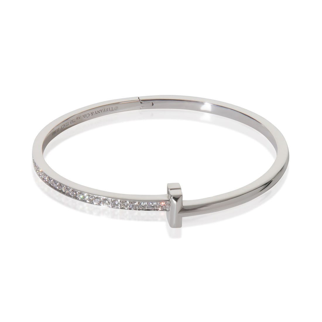 Tiffany T T1 Narrow 18k White Gold Diamond Hinged Bracelet 6.5 Inch: Tiffany T T1 Narrow 18k White Gold Diamond Hinged Bracelet 6.5 Inch This Tiffany & Co. T T1 Narrow Hinged Bracelet is crafted from 18k white gold and features round brilliant diamonds with a total car